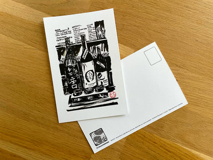 Carte postale " 3 bouteilles de saké au comptoir " - Studio Cartes Postales Nice