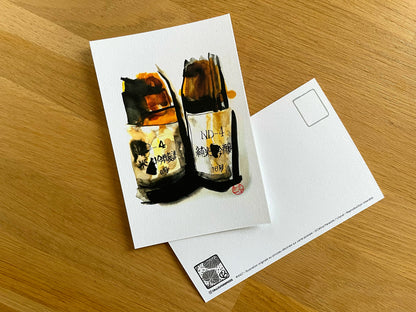 Carte postale " 2 bouteilles de saké inclinées "